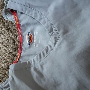 Dickies scrubs, in grey color. Top is XS Bottoms are XXS.